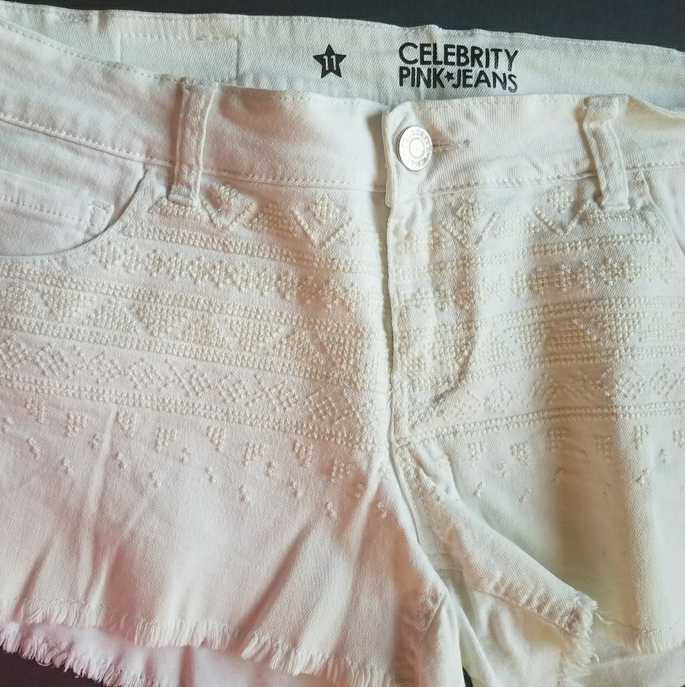 Wow them in these trendy white shorts!